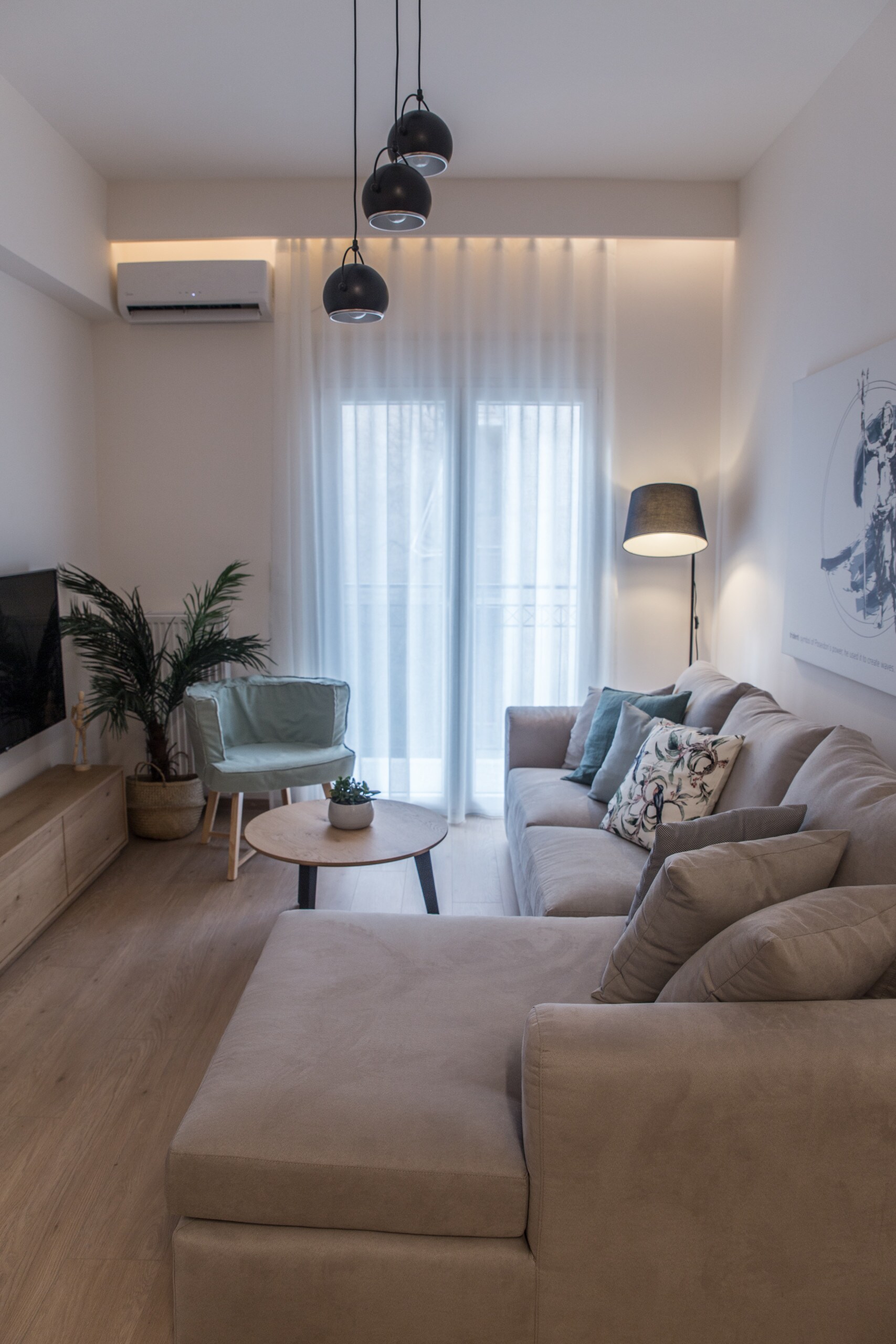 Living room with comfortable sofa, big smart TV connected to internet and high speed wi-fi Living room with comfortable sofa, big smart TV connected to internet and high speed wi-fi