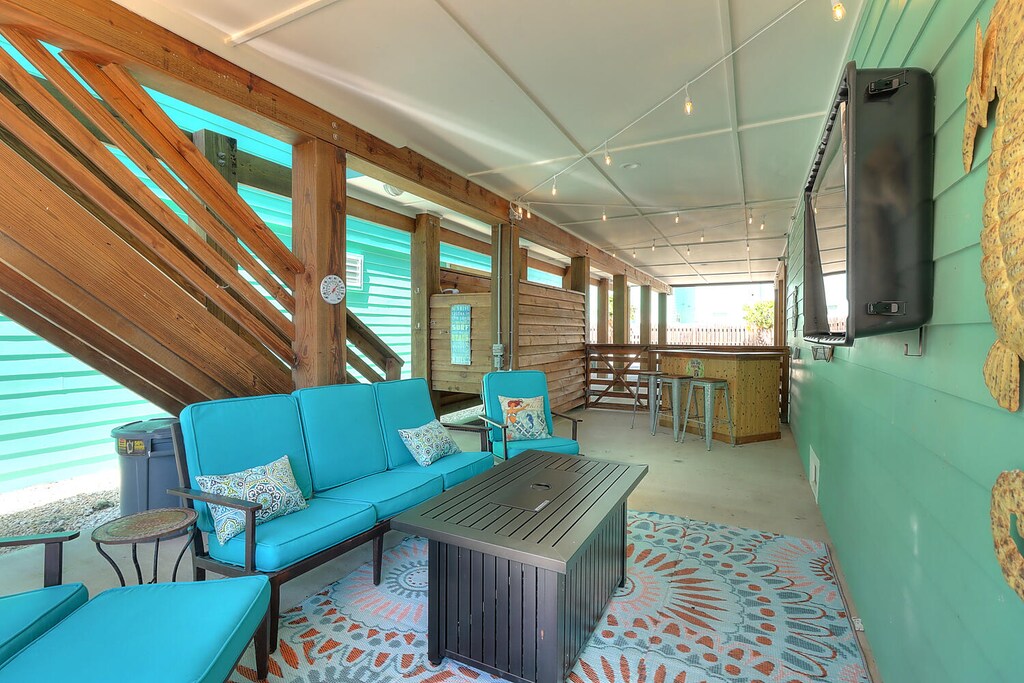 Outdoors. Guests can enjoy the property’s exterior entertainment area, offering the perfect space for outdoor dining and relaxation.