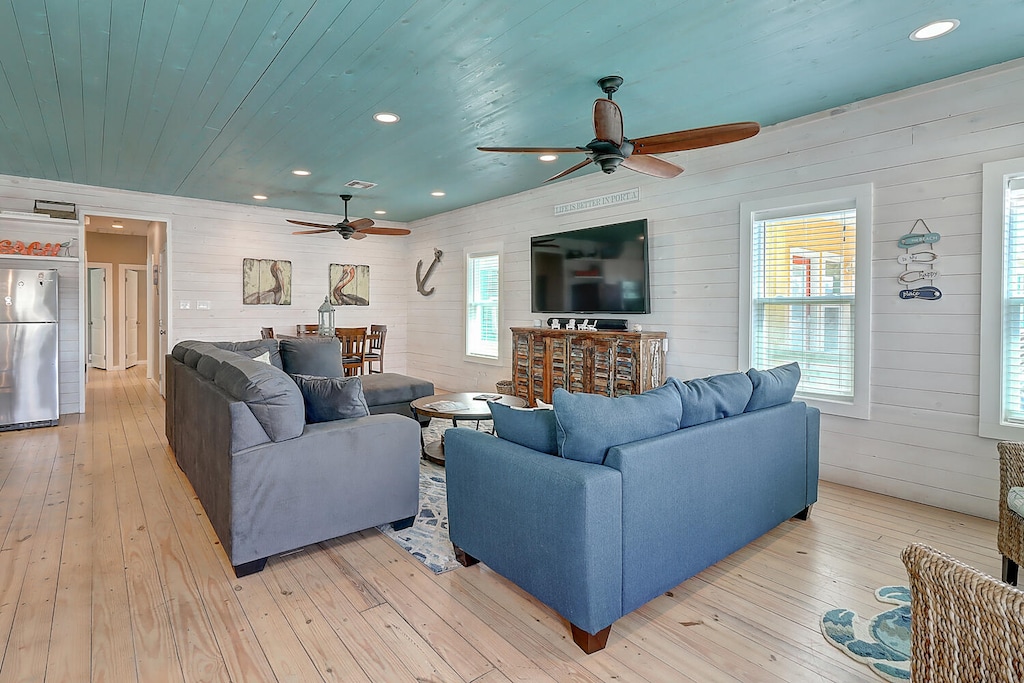Living Area. This coastal home blends soothing blue hues with elegant accents for a truly relaxing vibe.