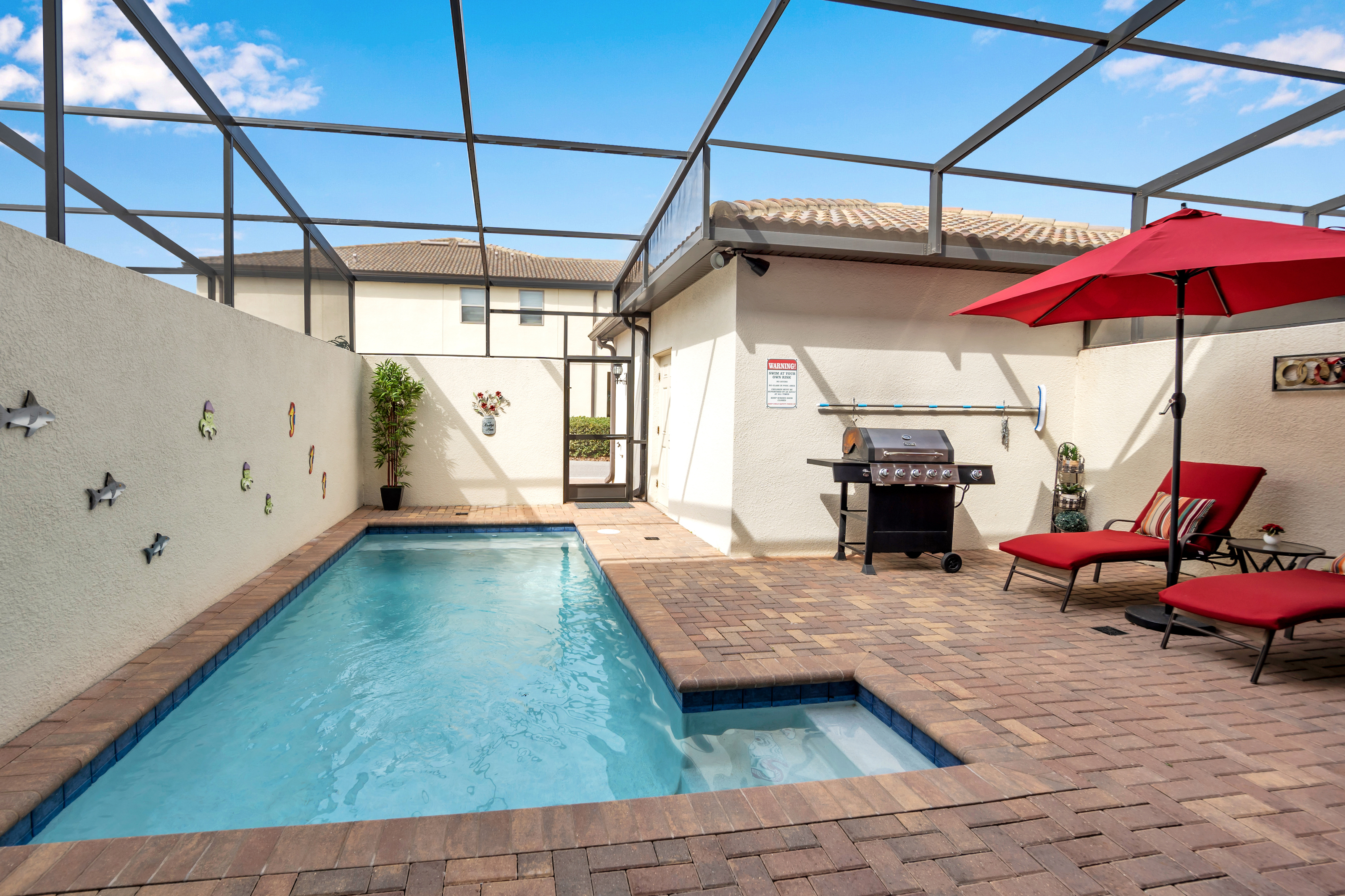 Opulent Pool Area of the townhouse in Florida near Old Town Kissimmee - Relax by the shimmering poolside oasis - Dive into a refreshing poolside escape - Comfortable lounge chairs for ultimate relaxation