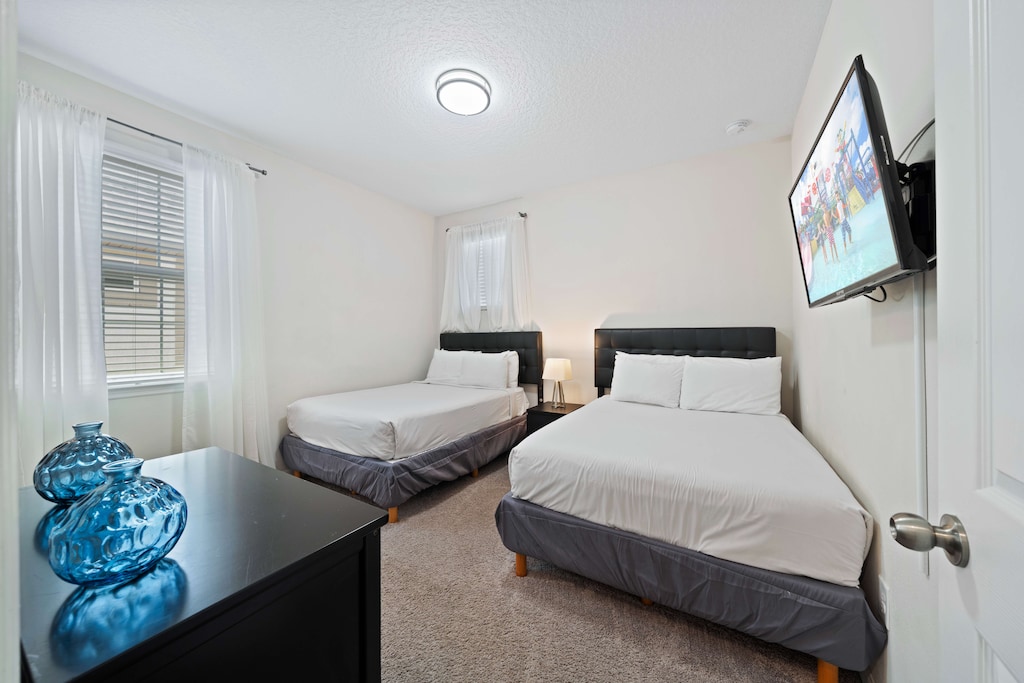 Bedroom 4 with 2 double beds and a private bathroom