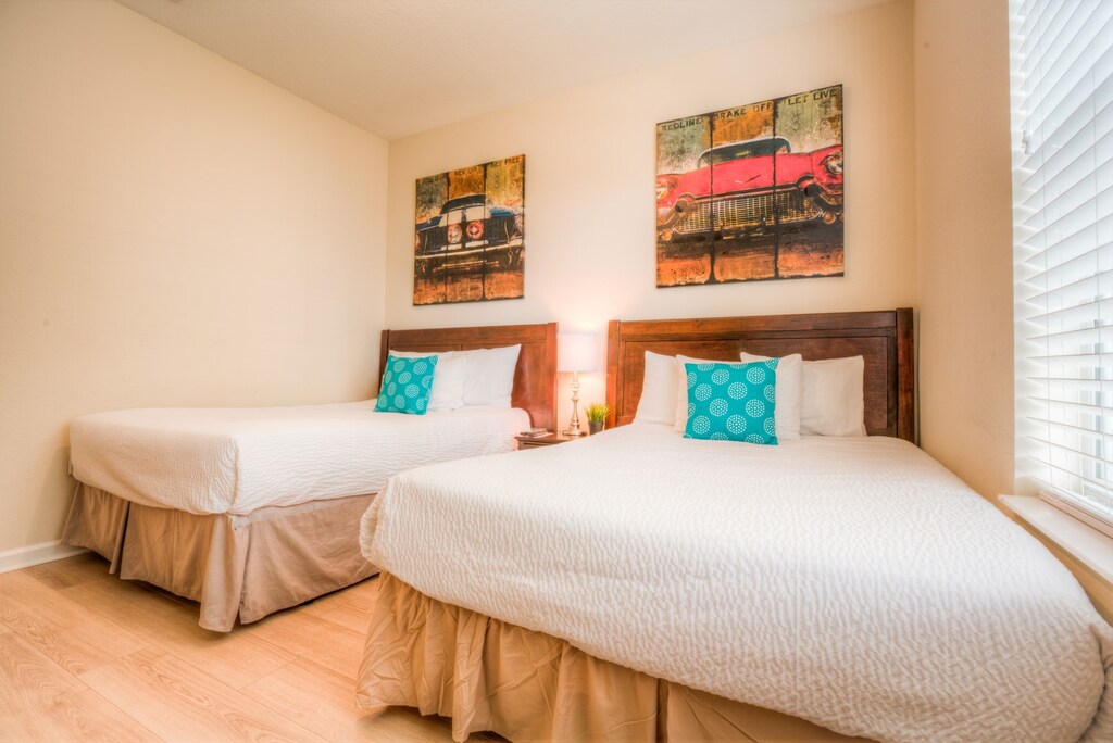 The third bedroom features two comfortable single beds, perfect for a restful night's sleep after a day of exploration.