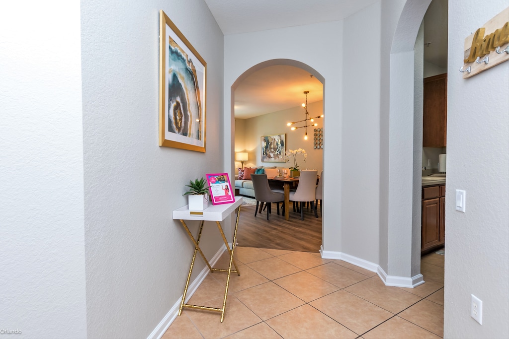 Traverse the inviting hallway, where every step unveils a path of comfort and elegance, beckoning you deeper into a world of tranquility and style.