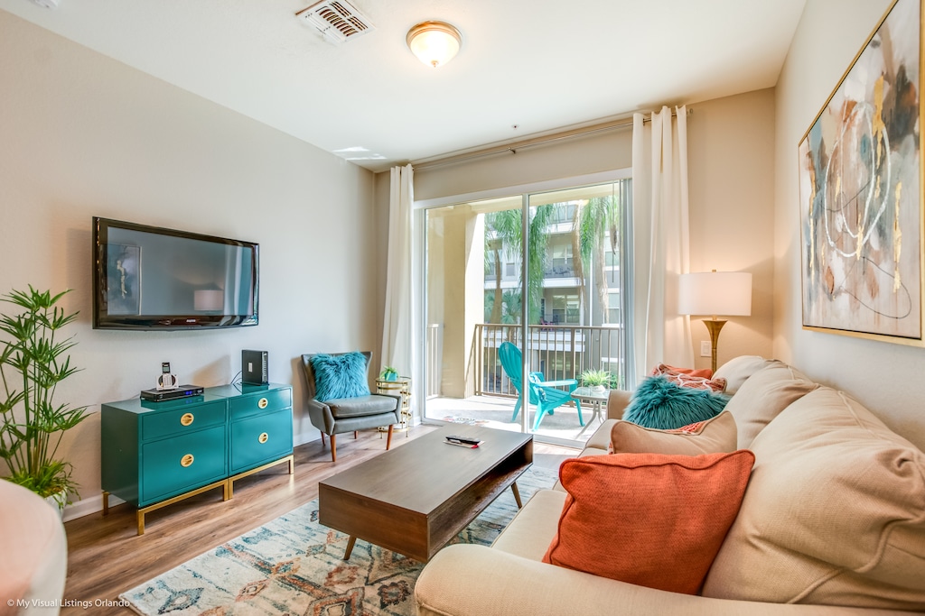 Inviting warmth fills the living room with its rich color palette, creating a cozy ambiance perfect for relaxation and gathering with loved ones.