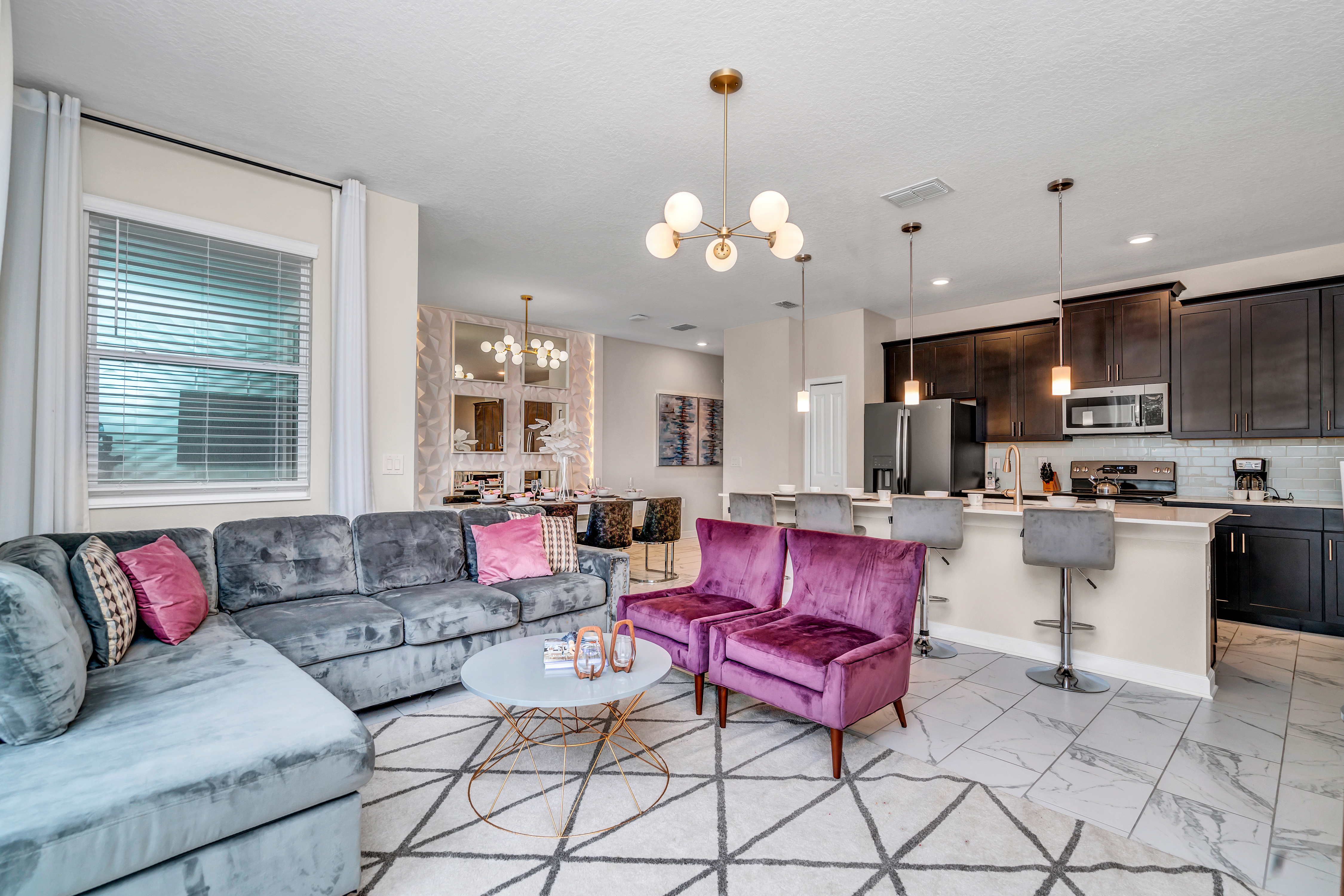 Modern Living Area of the Home in Kissimmee Florida - Comfy Sofas - Stylish furniture arrangement providing comfort and a cohesive look - Smart TV and Netflix - Well-chosen lighting fixtures adding both functionality and charm