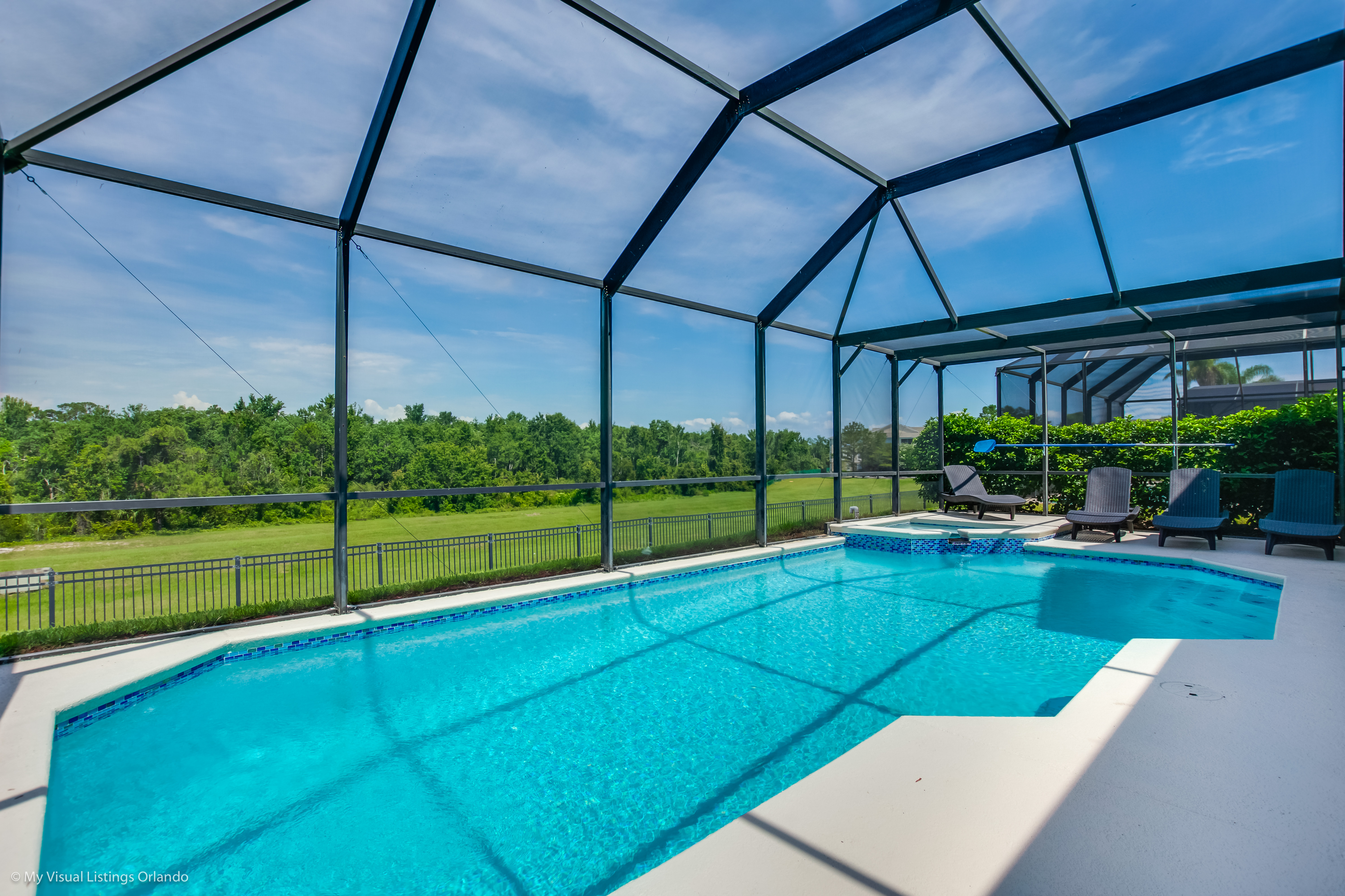 Splendid Shared Pool of the Apartment in Orlando - Cosy beach chairs available - Dive into refreshing poolside escape - Immerse yourself in the cool elegance of our pool - Experience ultimate relaxation in our poolside paradise
