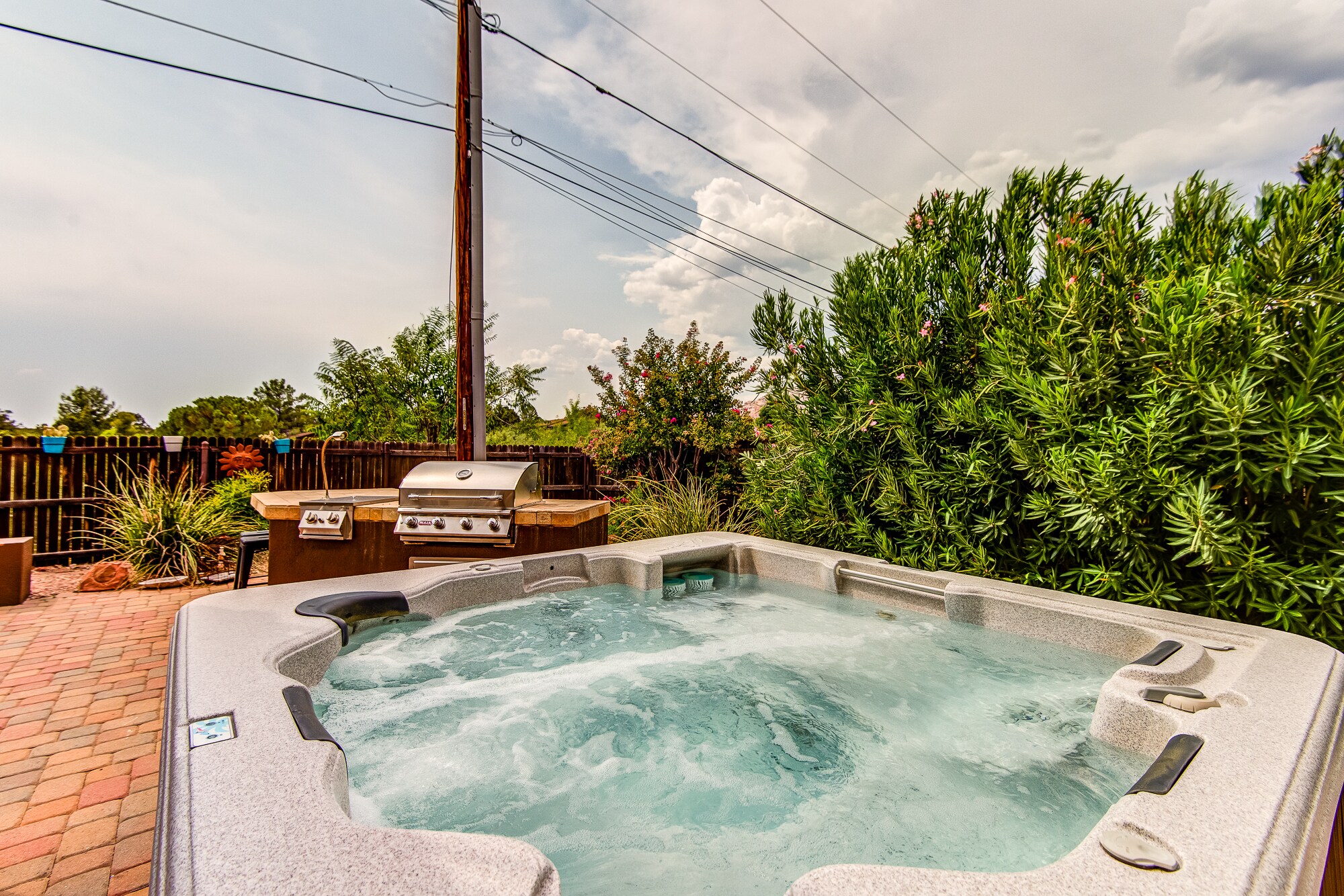 Expansive Back Patio with a Private 6-Seat Hot Tub, BBQ, Gas Fireplace, Sofa and TV