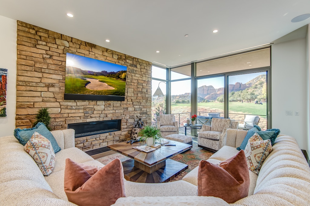 Living Room with a Large Sectional Sofa and Sony 77" 4K UHD Smart TV with Apple TV