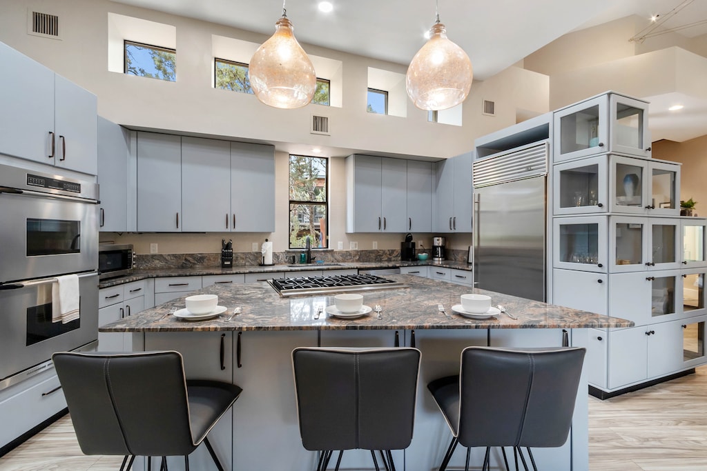 Well stocked kitchen with Island seating for three.
