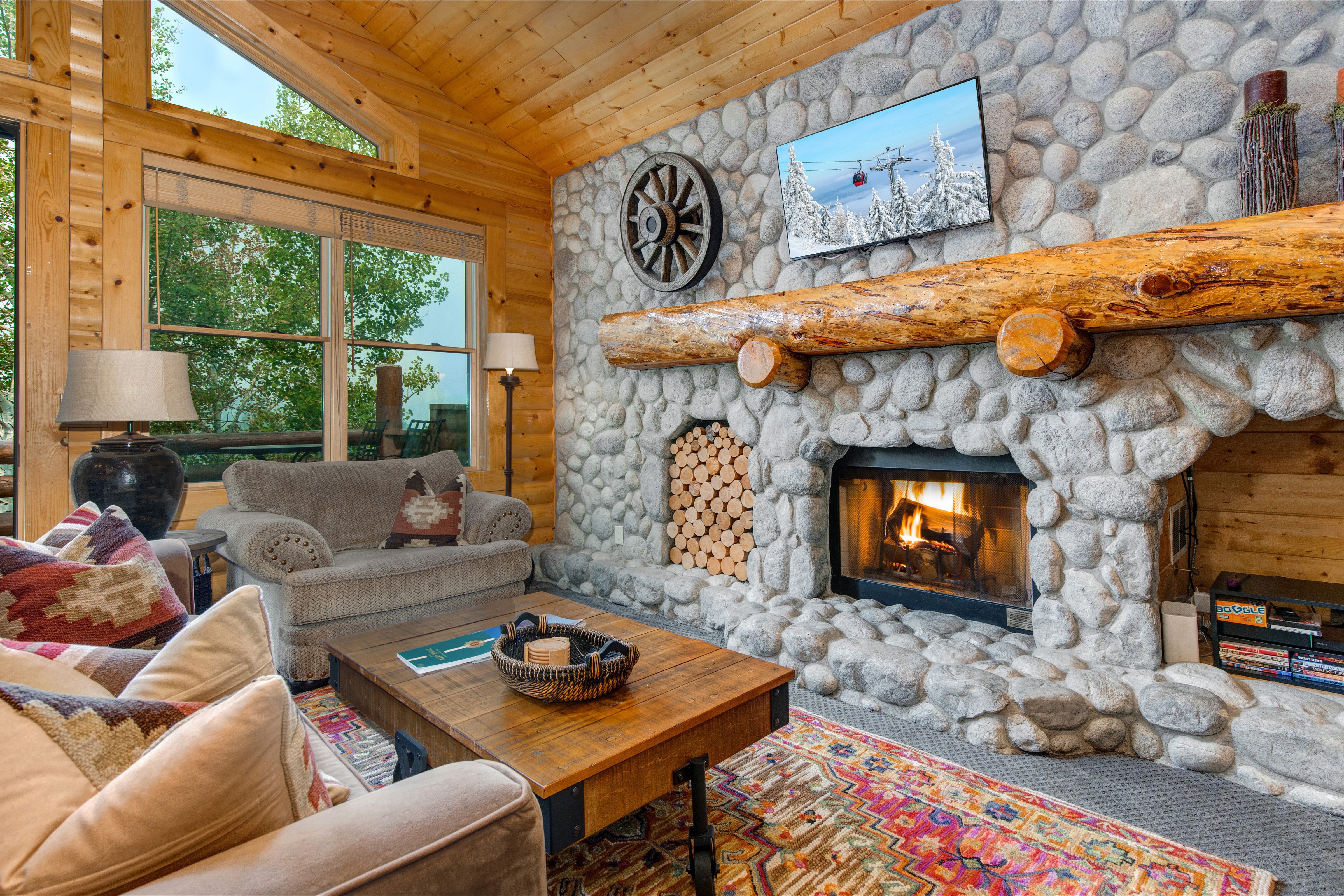 Living Room with a HDTV with Cable, Gas Fireplace, and Full-Sized Sofa Bed