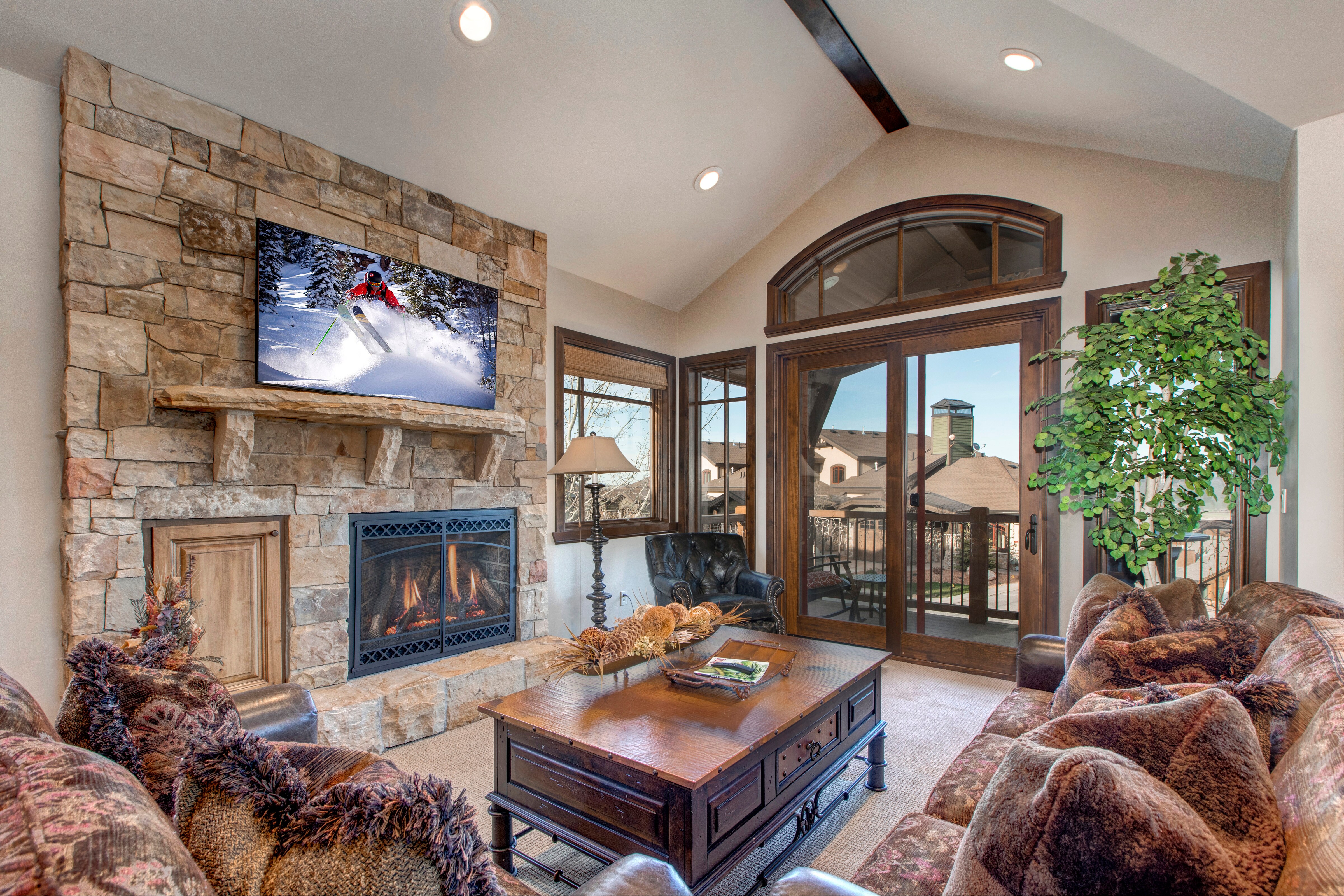 Living Room with 55" Samsung Smart TV, Gas Fireplace, Private Balcony Access, and beautiful mountain contemporary  furnishings