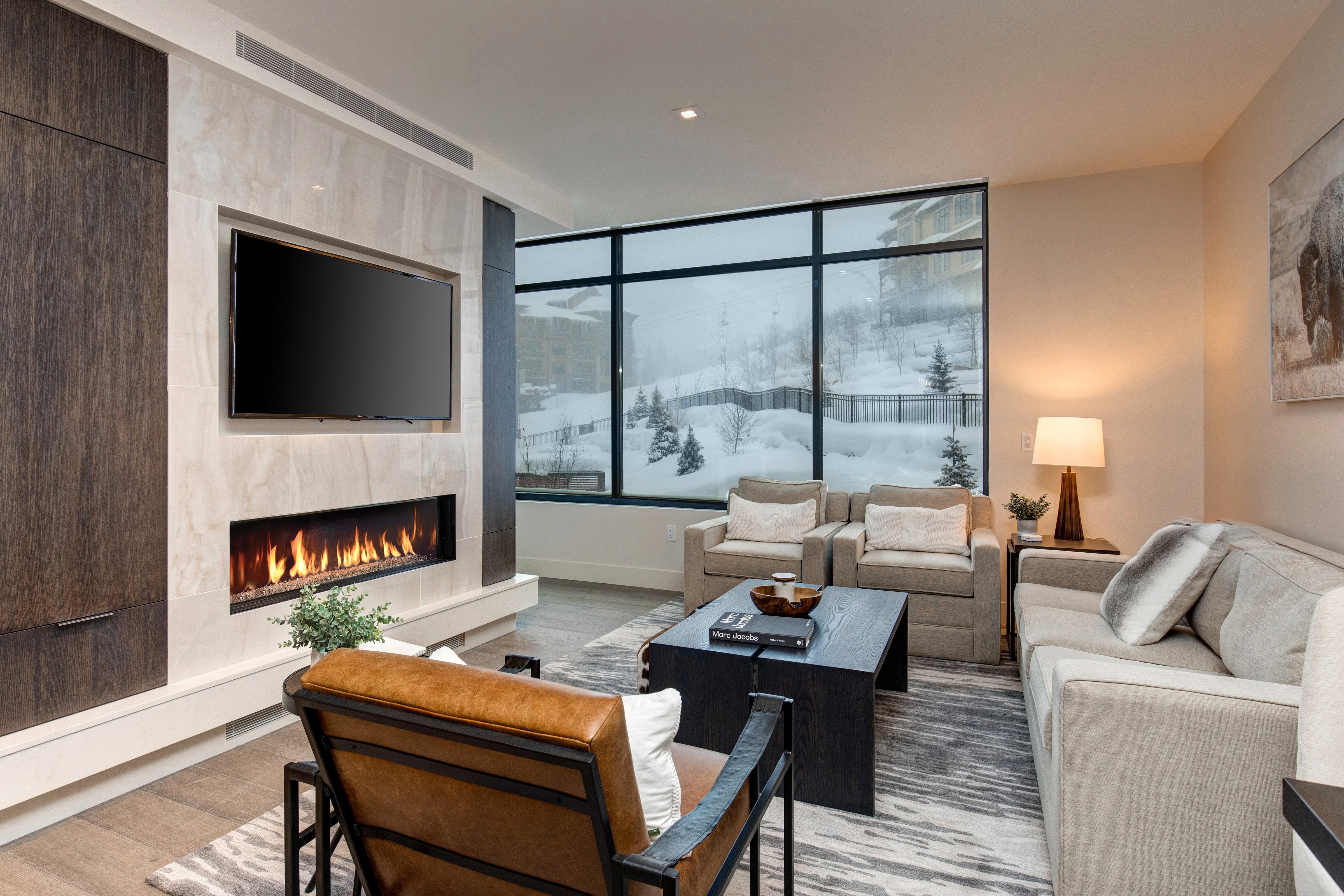 Living Room with 55" LG Smart TV, Gas Fireplace, and Private Balcony Access