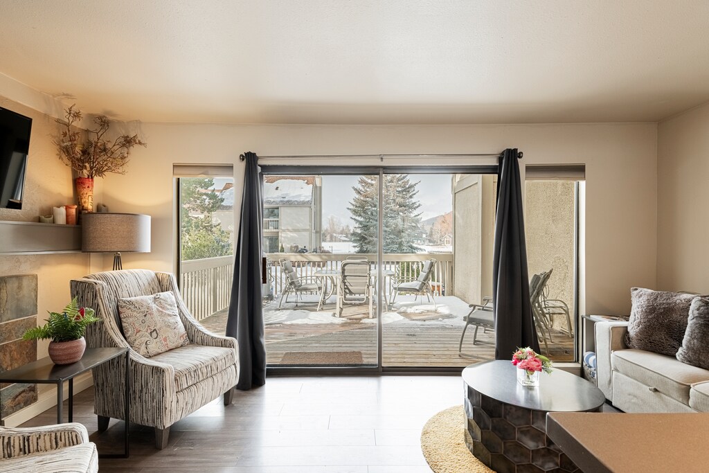 Living Room with Direct Access to Private Patio with a BBQ Grill and Seating