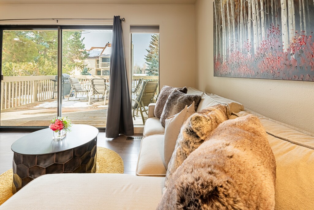 Living Room with Direct Access to Private Patio with a BBQ Grill and Seating