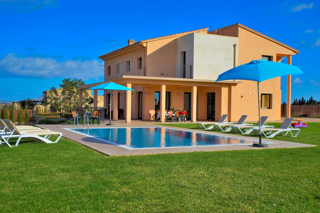 Holiday home with pool and sunbeds surrounded by nature 