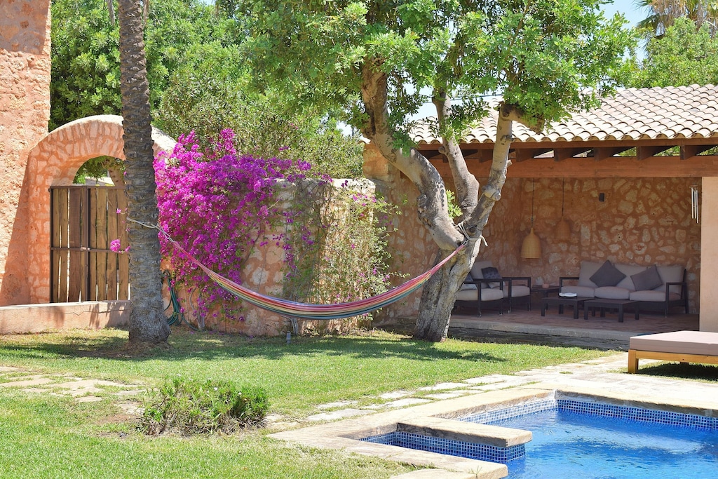 House with swimming pool surrounded by nature