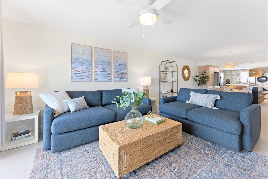 Spacious living area with plush seating and a modern beach-inspired design.