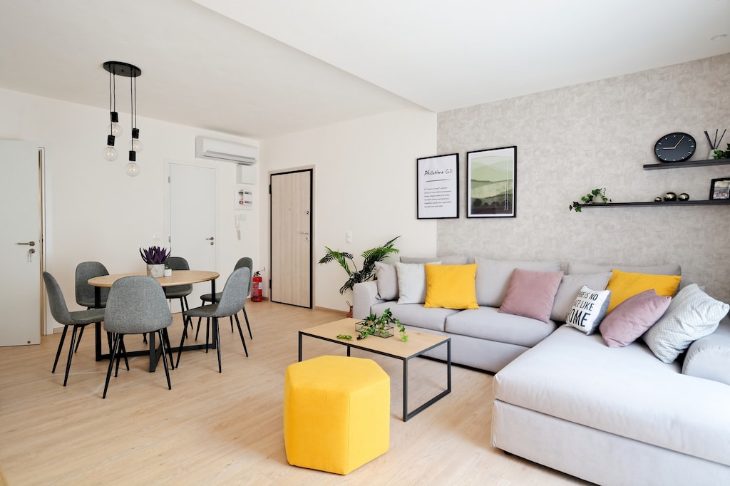 Dining and living room with lovely decoration and warm colors.
