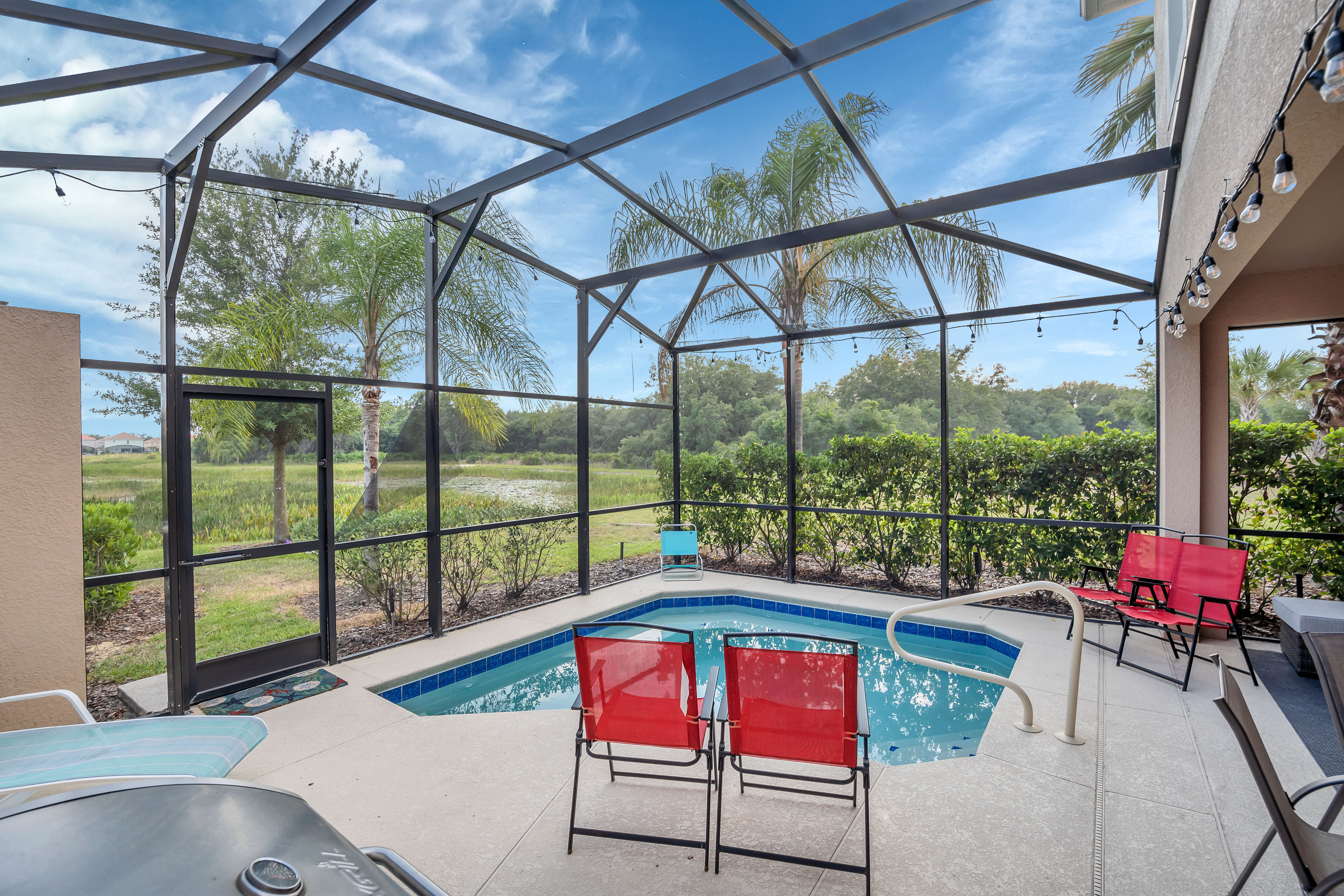 Captivating private pool of the townhouse in Davenport Florida - Bask in sun-kissed luxury near the water - Experience ultimate relaxation in poolside paradise - Comfortable lounge chairs for ultimate relaxation