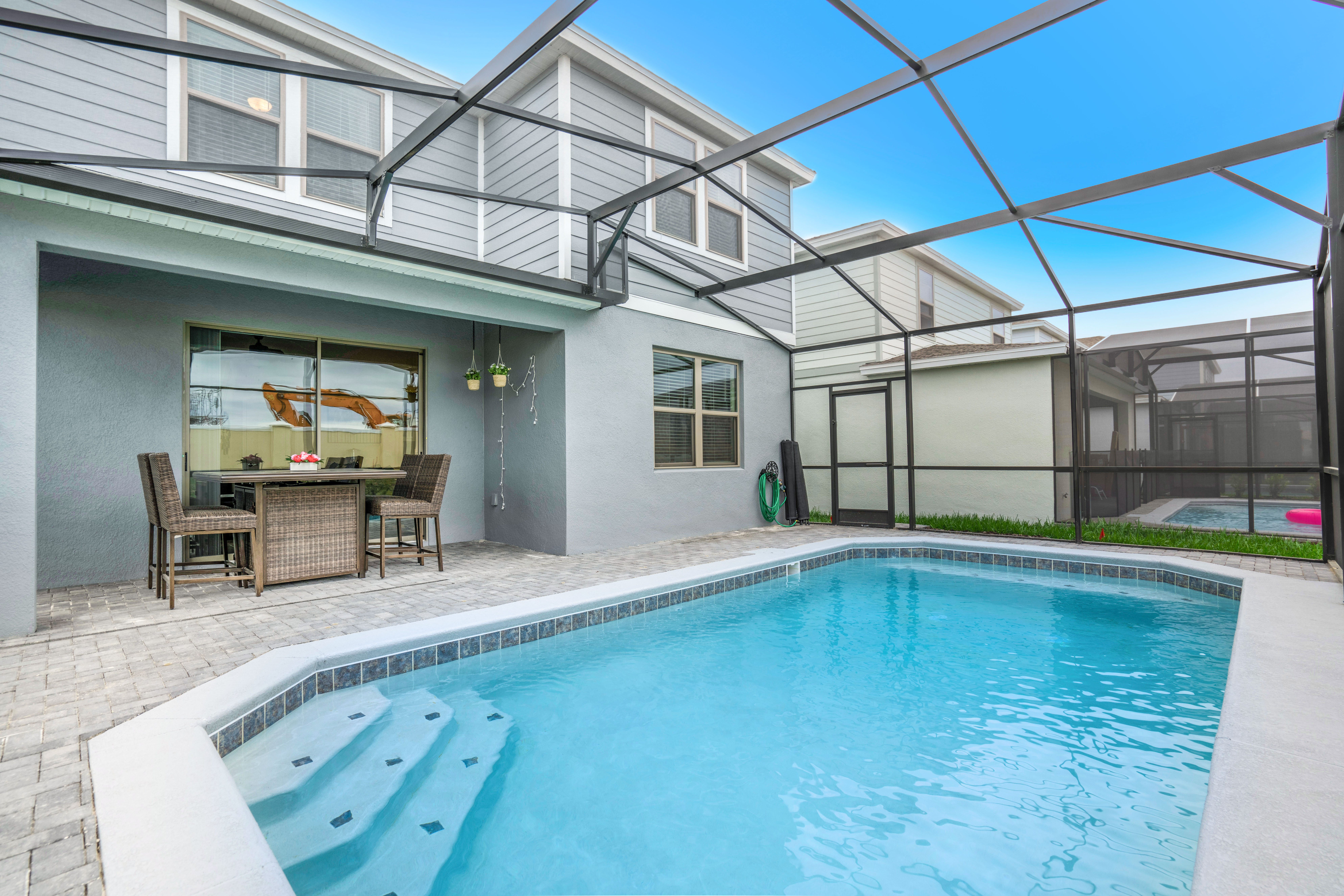 Splendid private Pool of the Apartment in Kissimmee - Cosy beach chairs available - Dive into refreshing poolside escape - Immerse yourself in the cool elegance of our pool - Experience ultimate relaxation in our poolside paradise