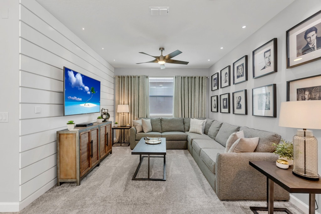 Elegant living area of the home in Kissimmee Florida - Thoughtfully decored space with a neutral color palette for a timeless appeal - Cozy seating area conducive to relaxation and socializing - Smart TV for entertainment