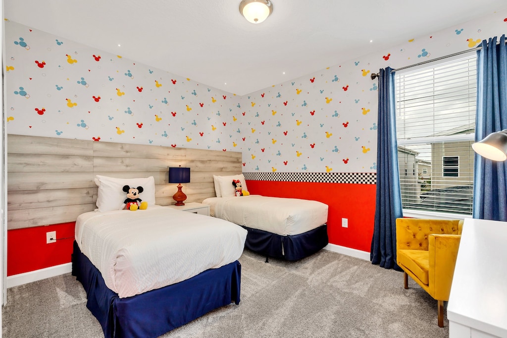 Mickey Mouse themed bedroom of the home in Kissimmee Florida - Two cozy double bed - Cozy and inviting ambiance for relaxation - Smart TV for entertainment