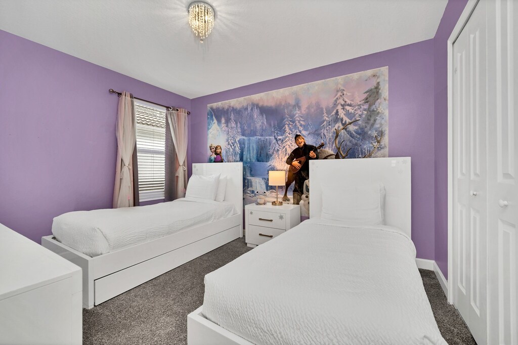 Frozen themed bedroom of the home in Kissimmee Florida - Featuring two single beds - Thoughtfully designed for comfort and style - Plush bedding and pillows for a luxurious feel