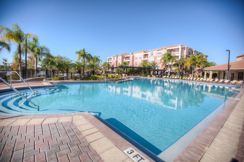 - Dive into paradise at Vista Cay Resort's expansive pool in Orlando - Where the sparkling water invites you to relax, refresh, and revel in the beauty of leisure. - Immerse yourself in luxury and tranquility.