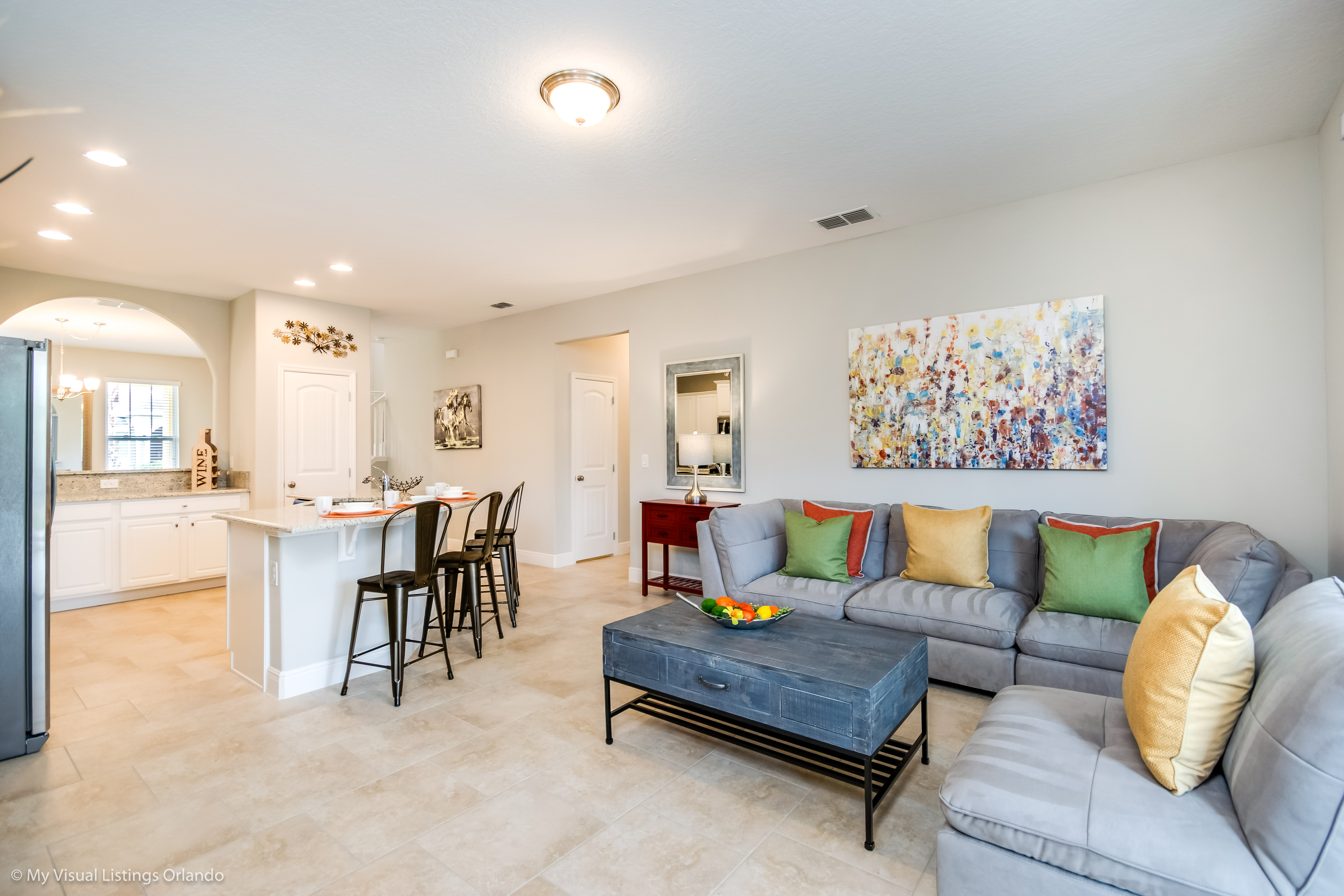 Inviting living area of the home in Davenport Florida - A warm and welcoming retreat - Combining comfort with contemporary design for an unforgettable stay - Open-concept living area seamlessly connected to a stylish kitchen