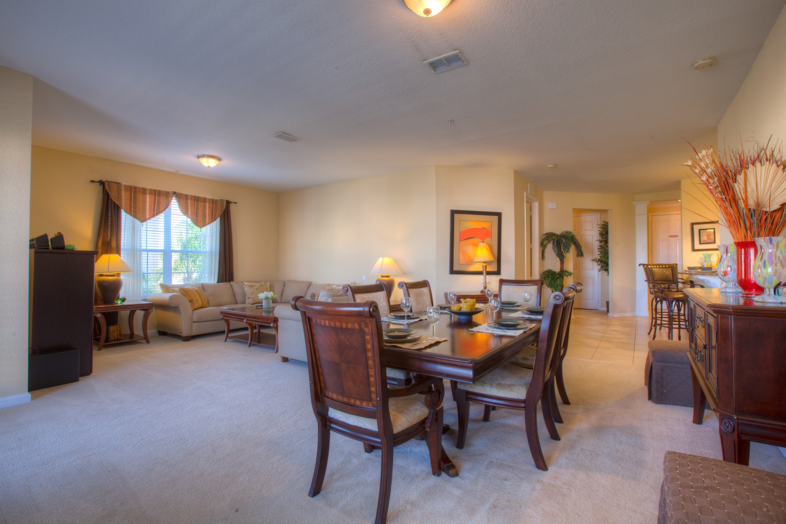 Gather, Dine, and Relax: Embrace the Warmth of our Welcoming Dining and Living Area Adorned with Wooden Furnishings.