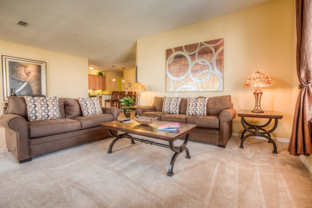 Step into our cozy living room, where warmth and comfort embrace you. With its inviting ambiance and plush furnishings, this space invites relaxation and cherished moments with loved ones.
