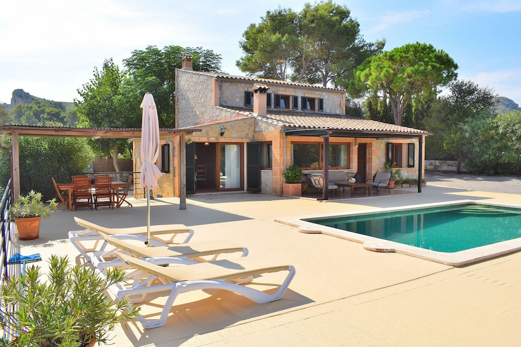 holiday home surrounded by nature with swimming pool and sunbeds 