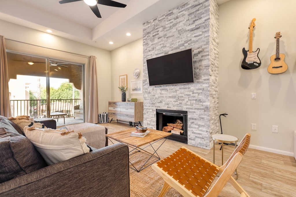 Living room features a fireplace and TV.