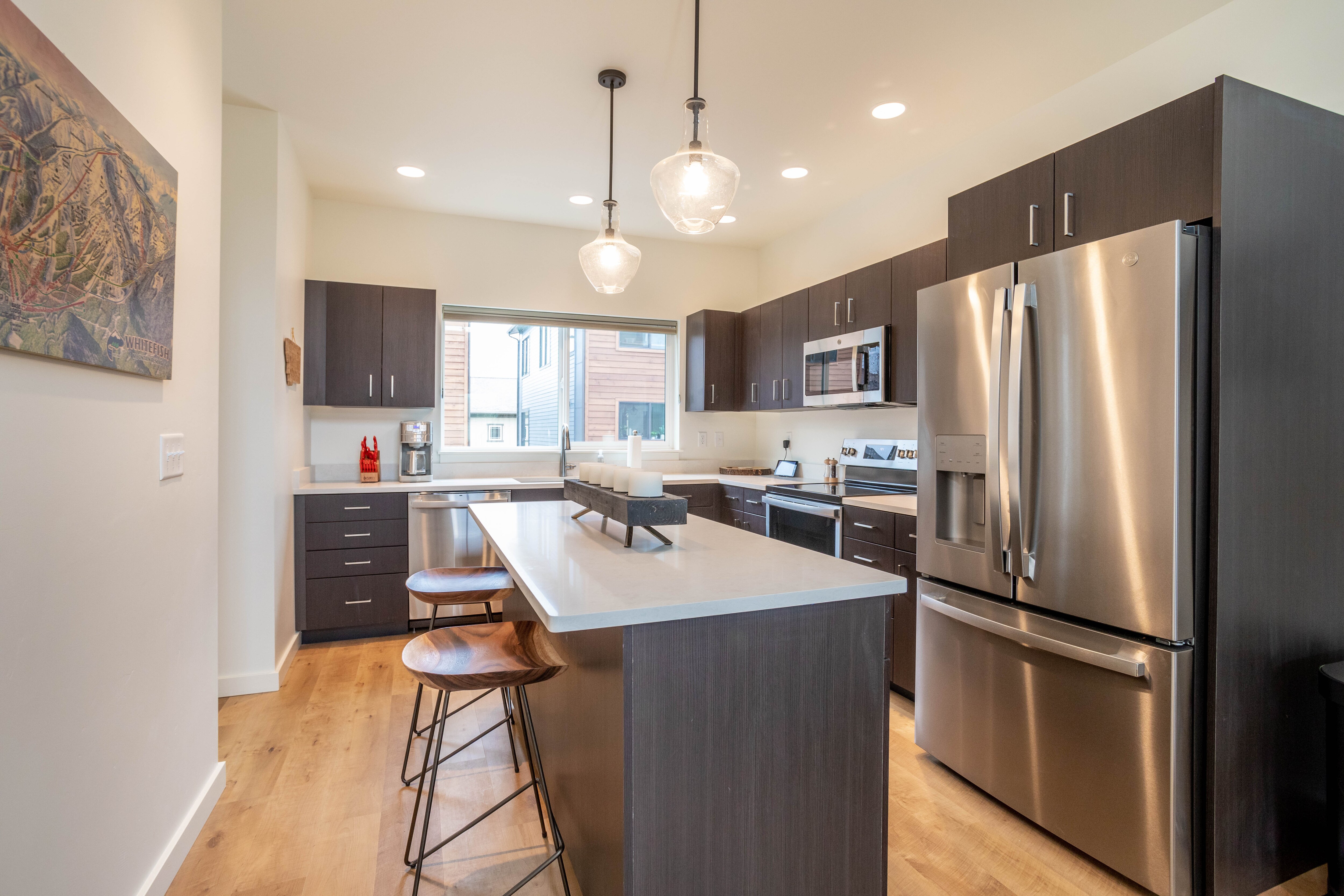 This modern kitchen is fully equipped with stainless steel appliances | Main Level