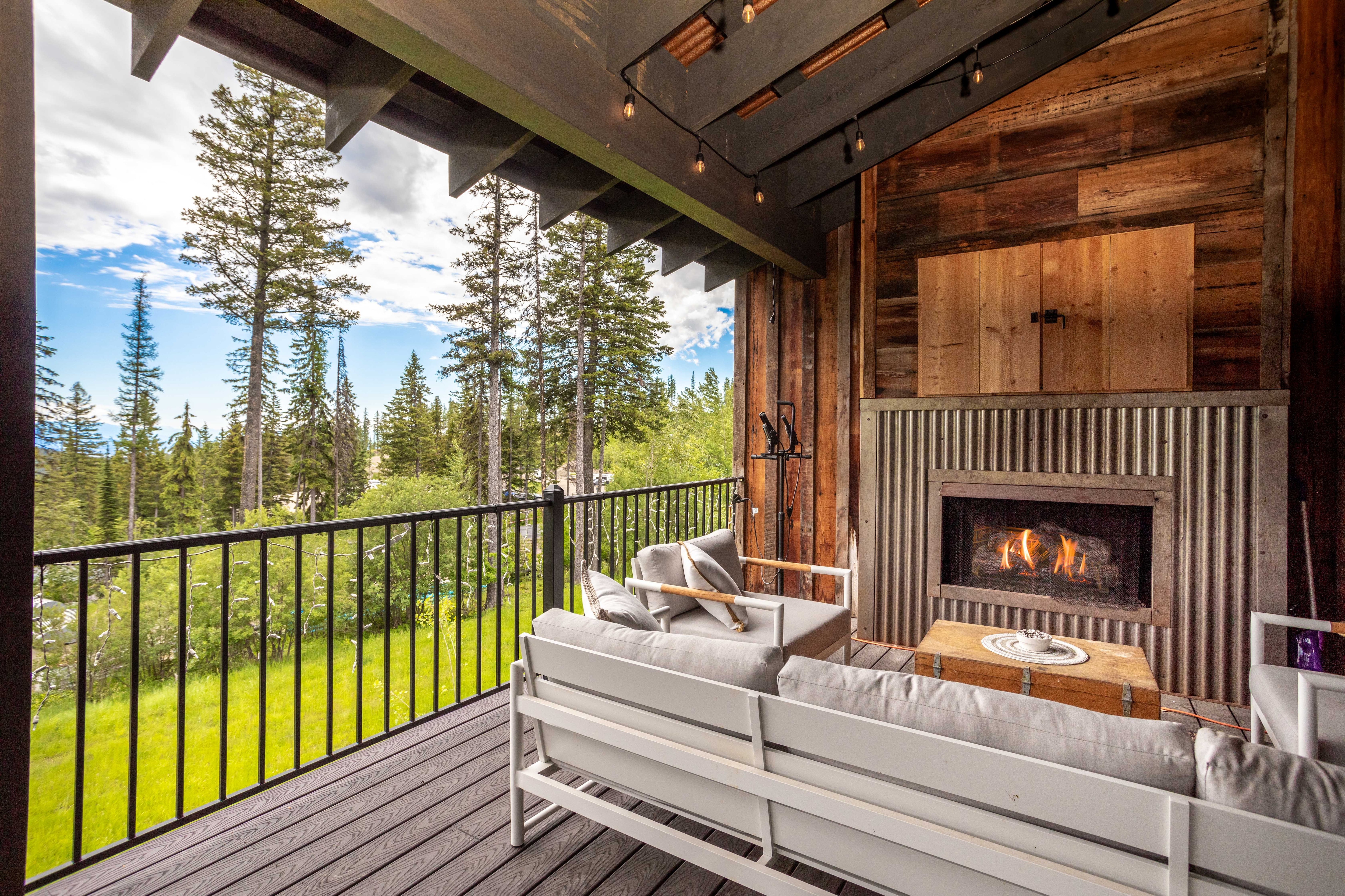 Cozy up by the outdoor fireplace and enjoy the beautiful views | Exterior