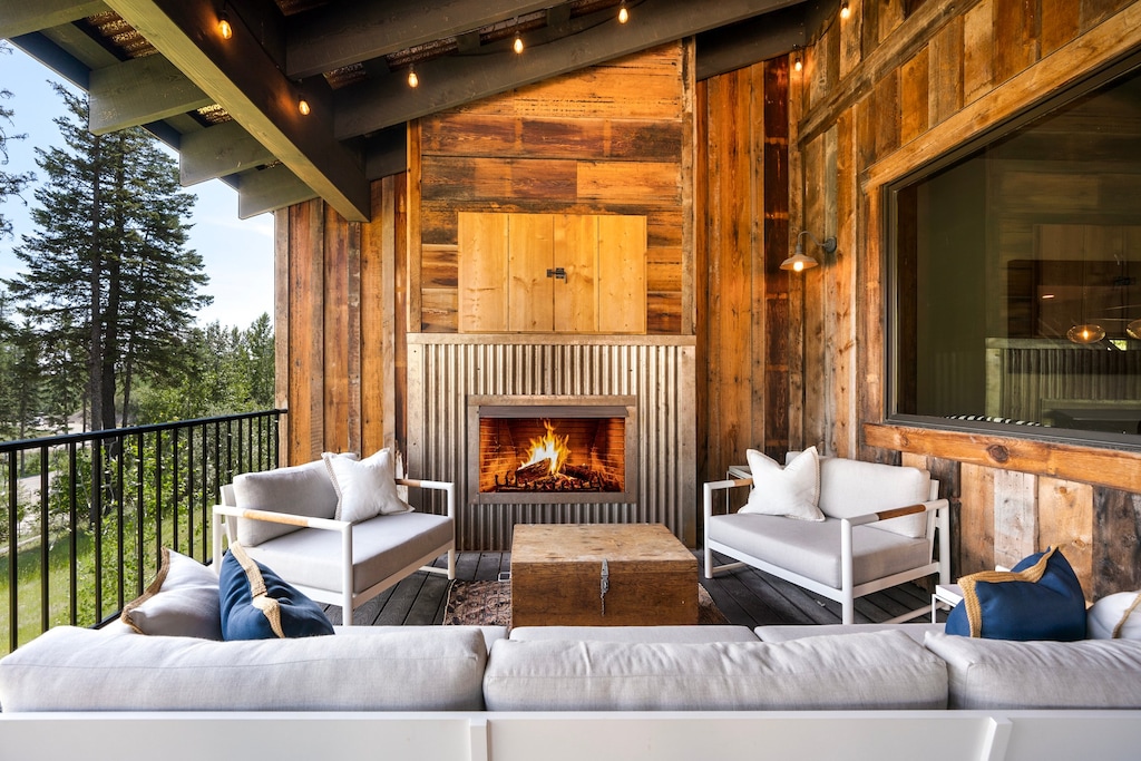 Cozy up by the outdoor fireplace and enjoy the beautiful views | Exterior