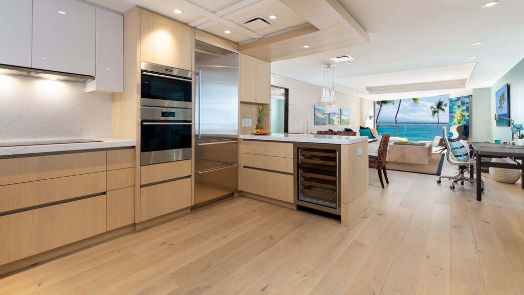 The gourmet kitchen is equipped with high end appliances, lots of room for your cold beverages