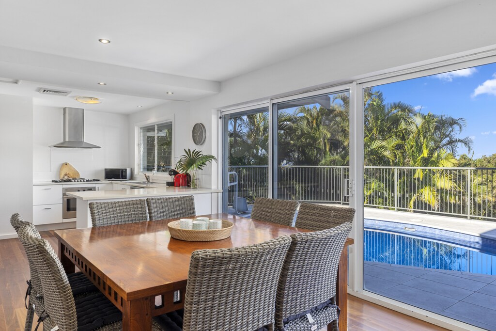 4. Dining table and kitchen overlooking pool