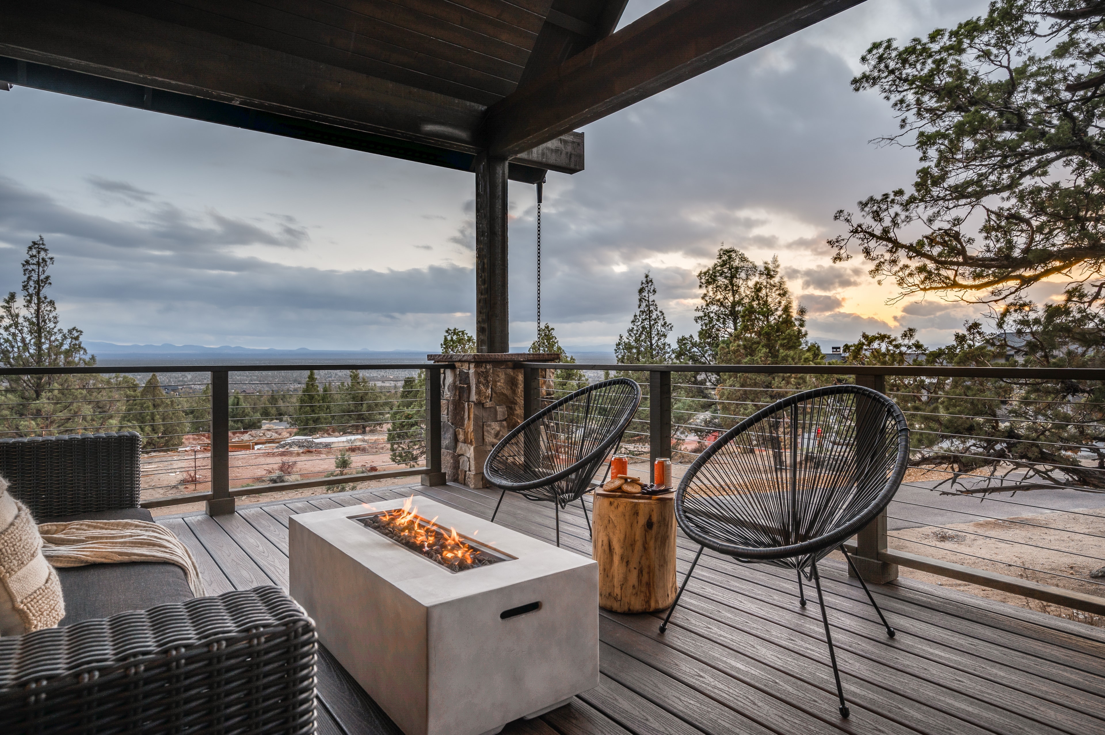 Sit by the outdoor fireplace and enjoy the view.