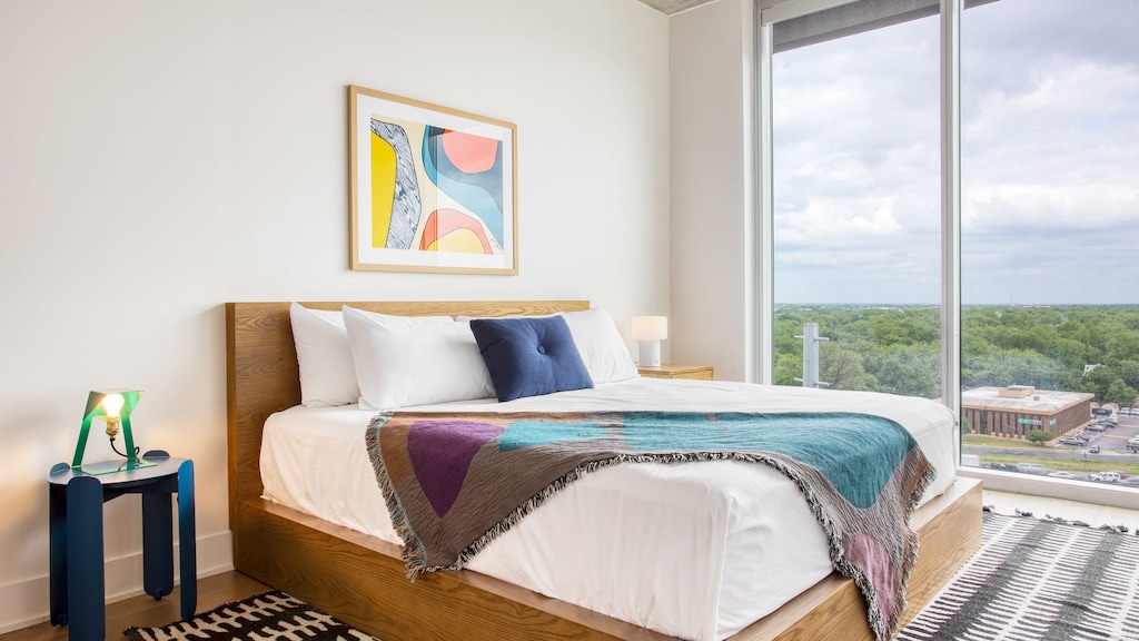 Beautiful bedroom with views of Austin. 