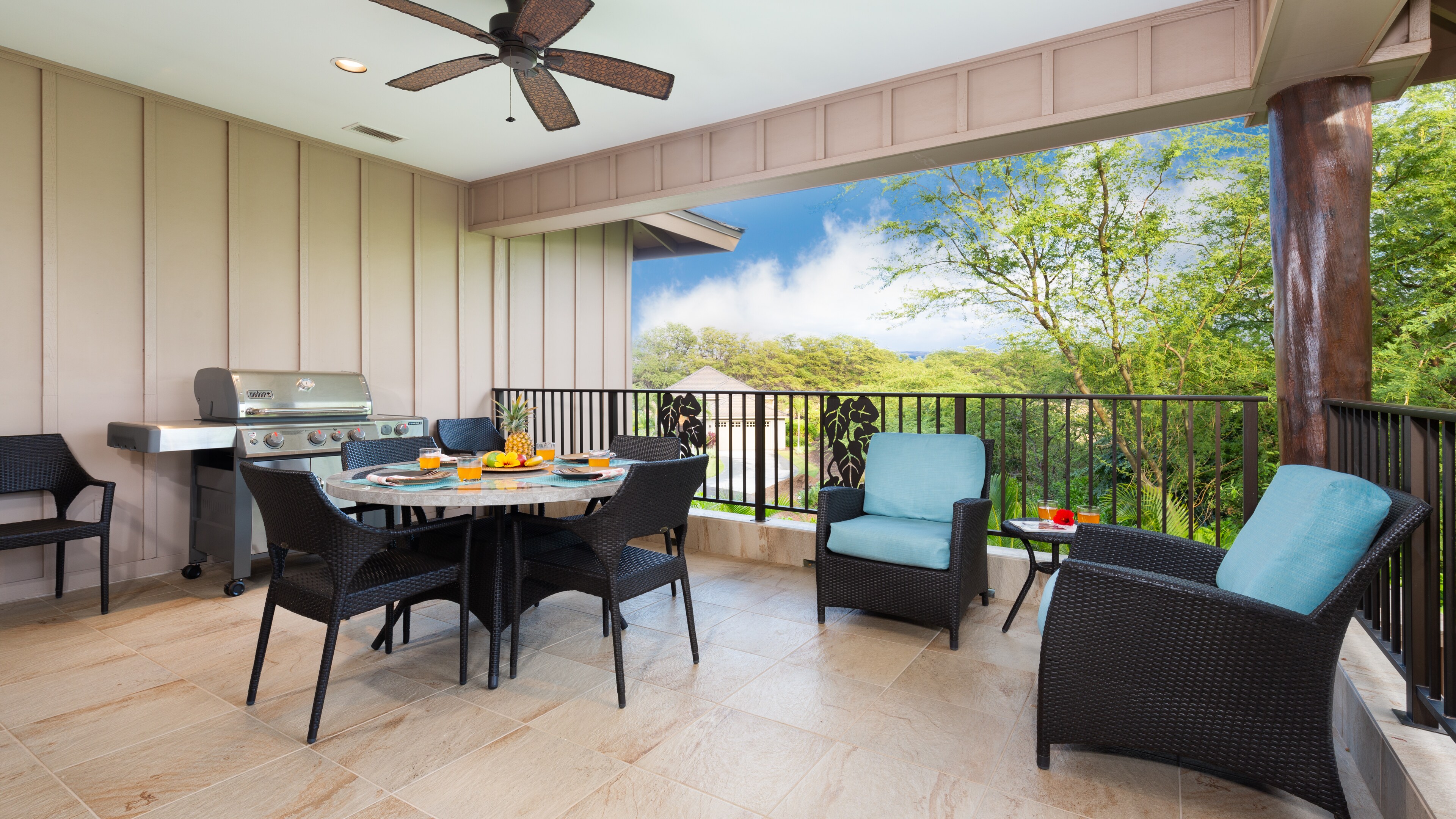 Outdoor lanai with dining table and private BBQ