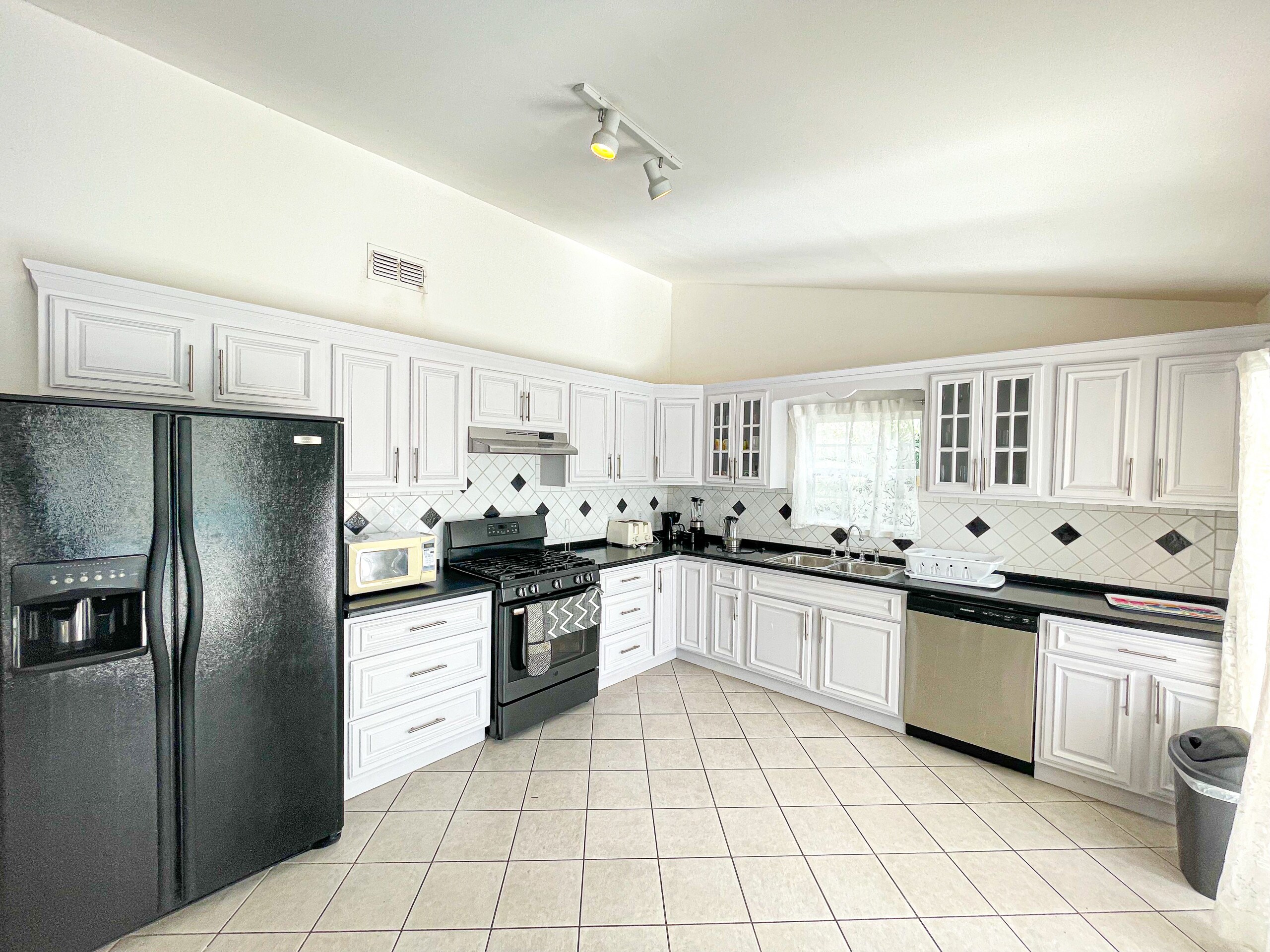Large fully equipped kitchen, spacious living area, private pool, alfresco dining at Harbour View villa rentals, Antigua 