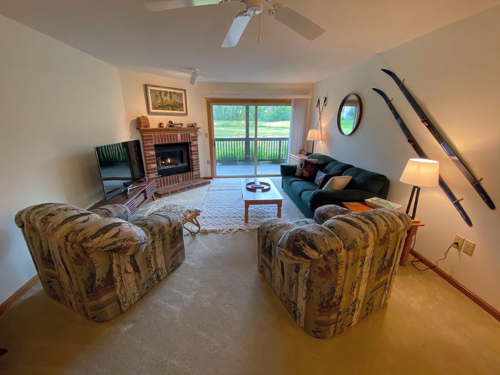 Main living area with gas fireplace, TV and games