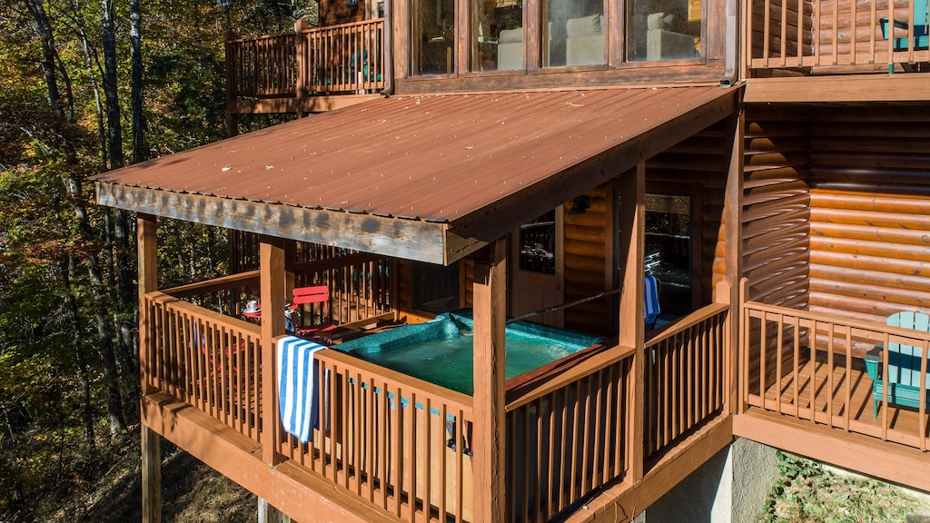 Covered hot tub and multiple balconies.