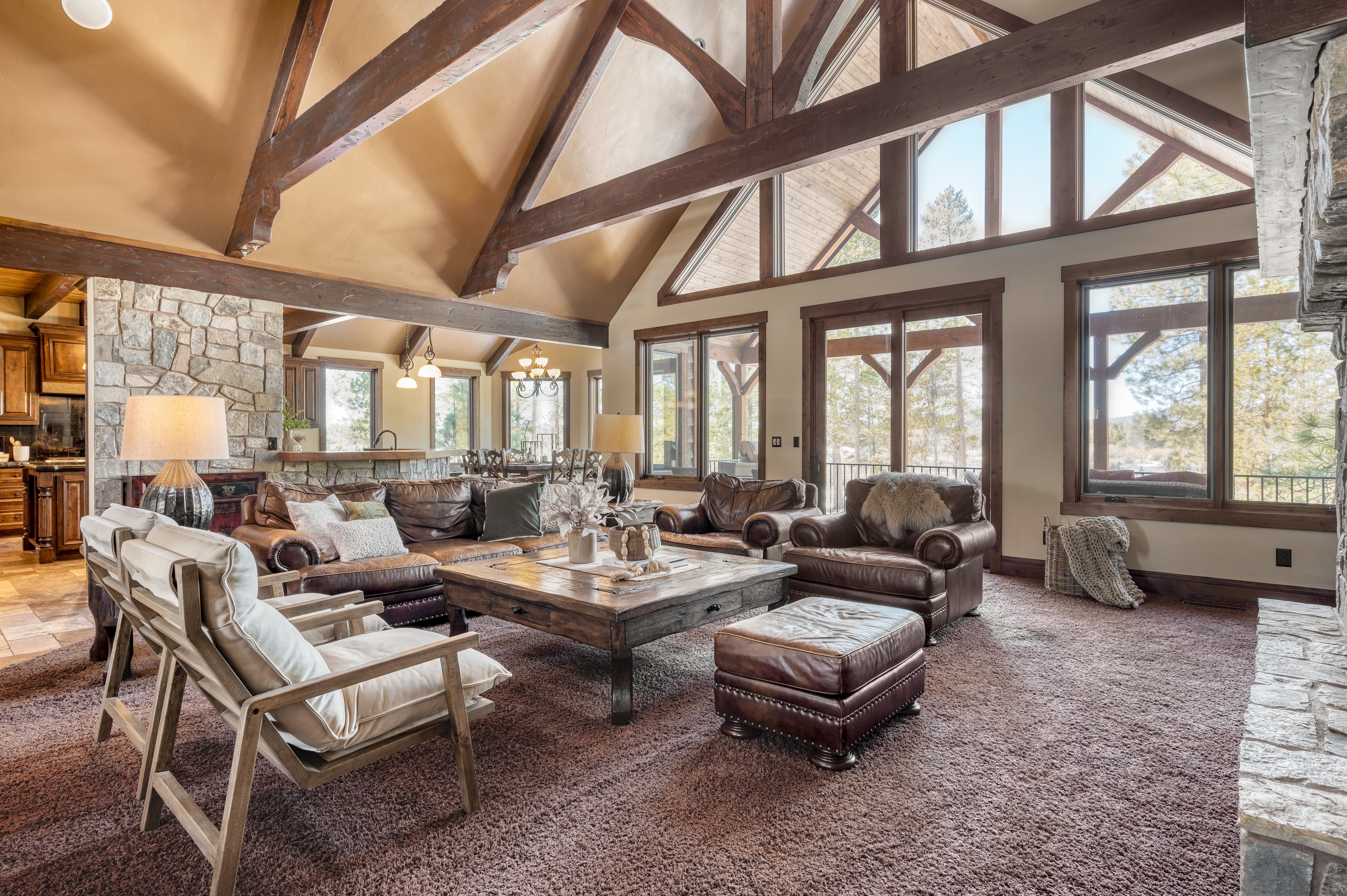 Spacious main living room features high ceilings and plenty of seating.