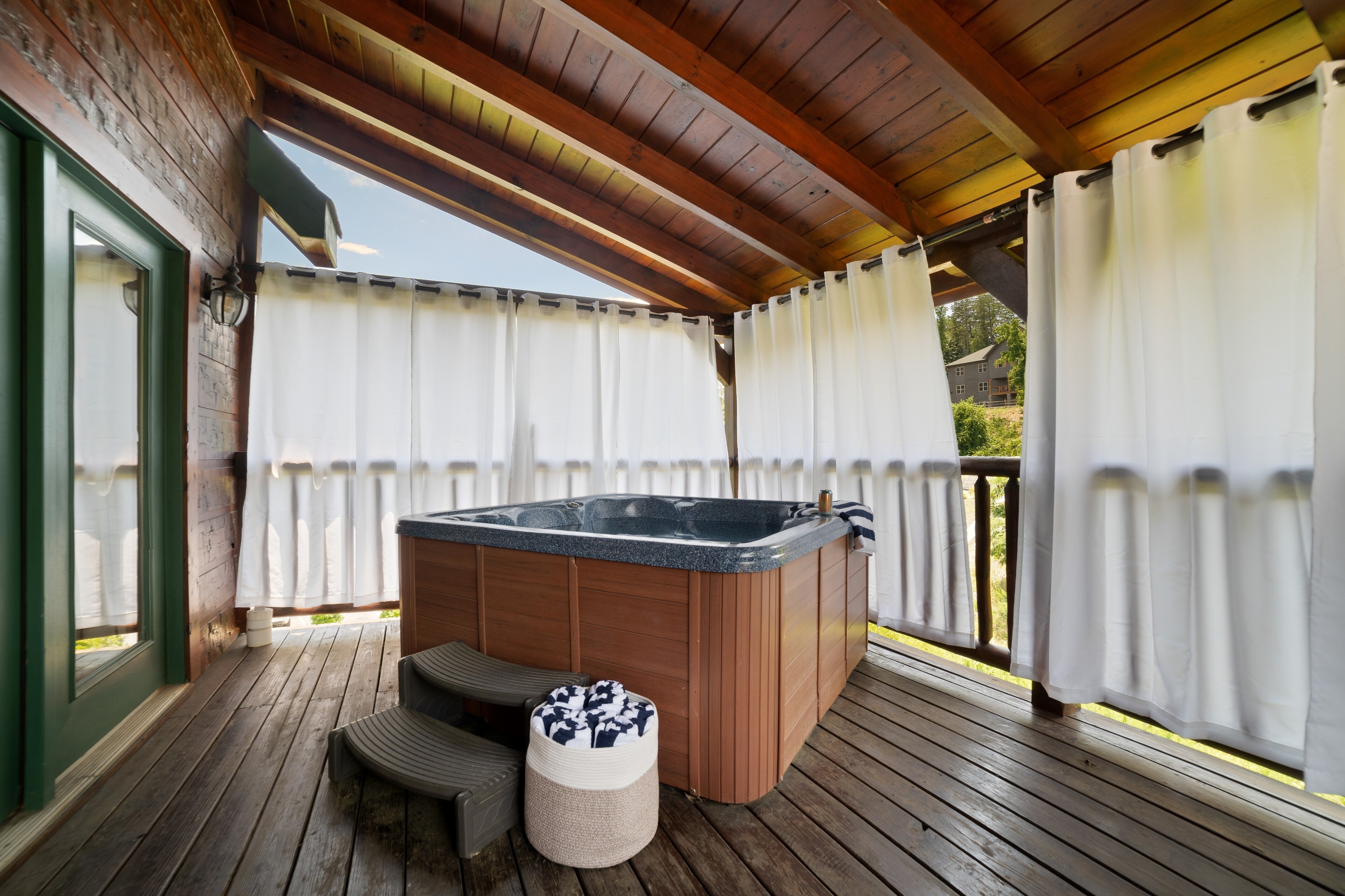 The hot tub can be accessed from the living room as well as from Bedroom 2.