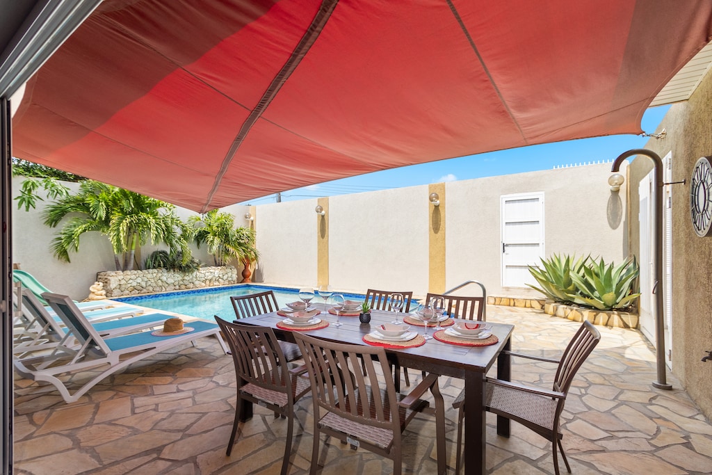 Experience alfresco dining at its finest with our poolside dining table, where every meal is served with a side of sunshine and relaxation.