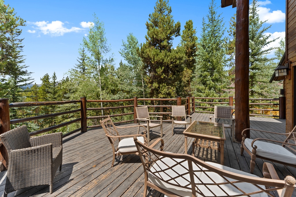 The spacious wrap-around deck offers beautiful views and outdoor seating. 