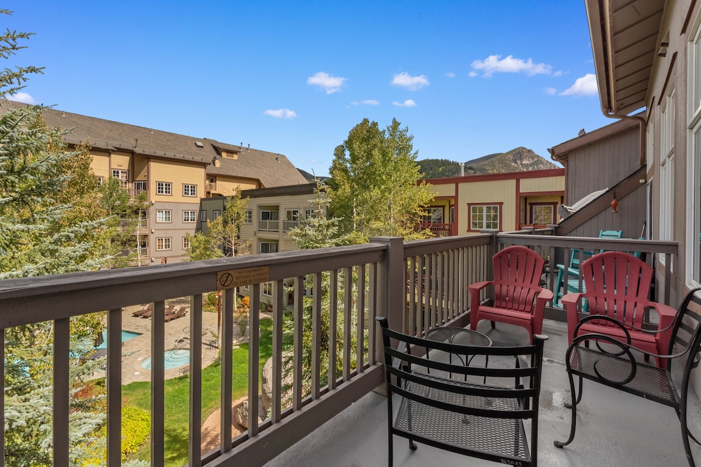 Private balcony with outdoor seating and pool views!