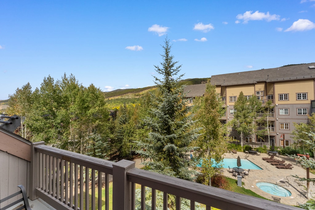 Private balcony with outdoor seating and pool views!
